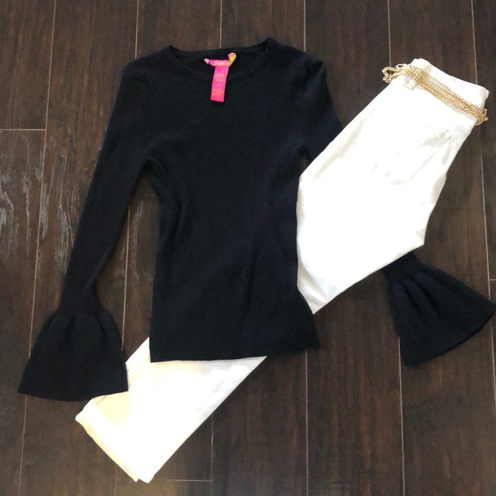 Black knit sweater with fun detail